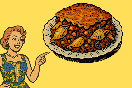 Ash smiling beside a retro-style casserole dish filled with baked sea shell macaroni, tomato sauce, ground beef, and golden melted cheese on top